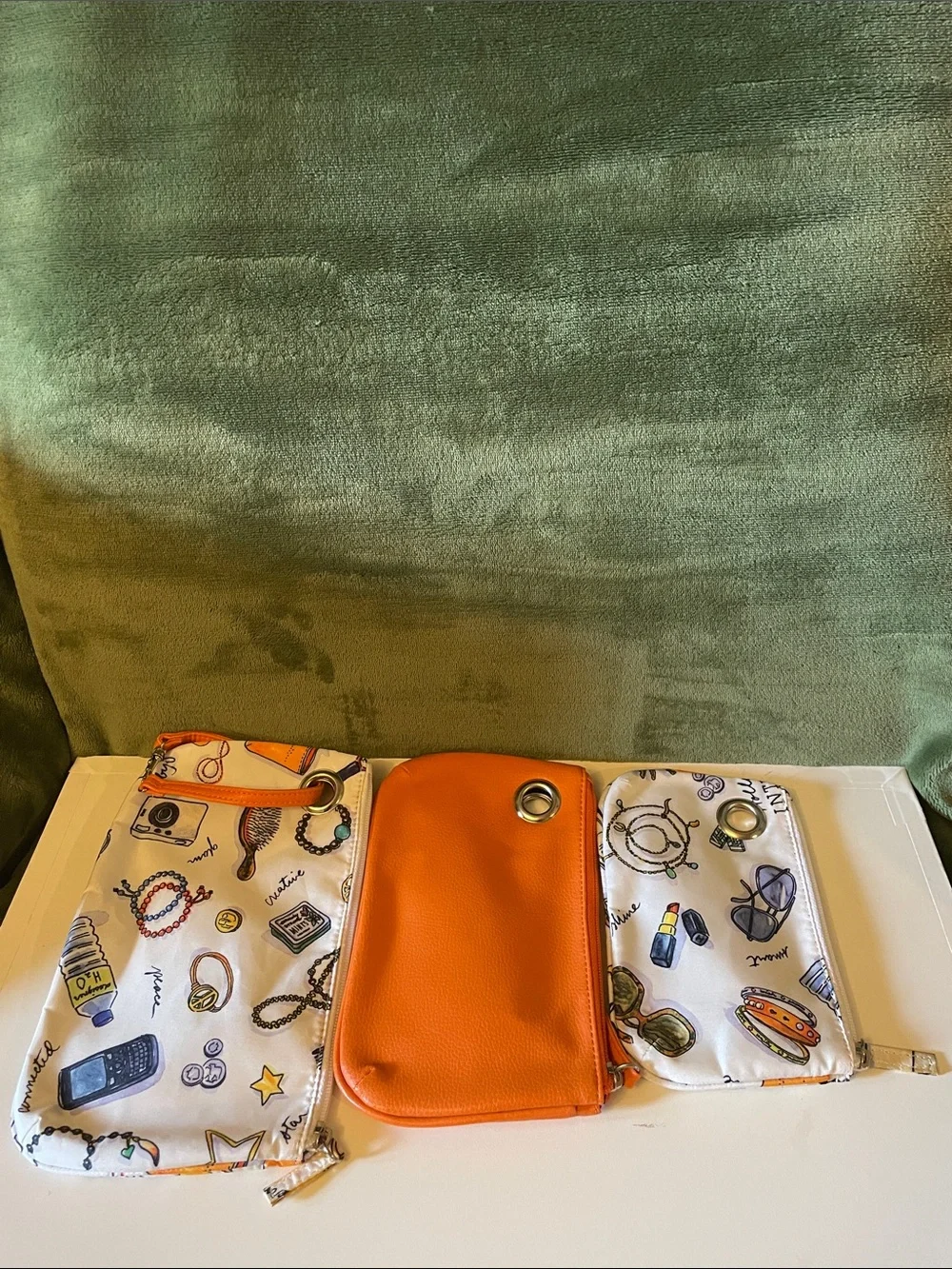 3 Piece Set of Cosmetic Bags; 1-Orange(Non/leather), 2- Multicolored(Cloth)